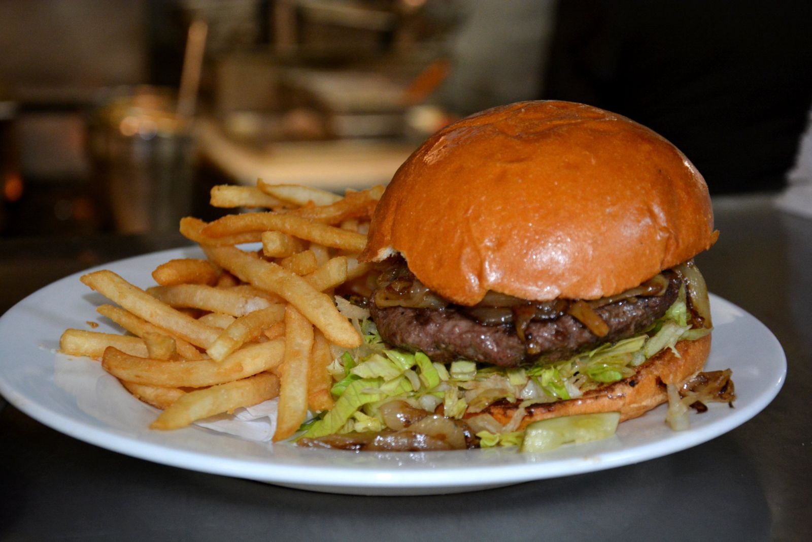 Wagyu burger with grilled onions and fries